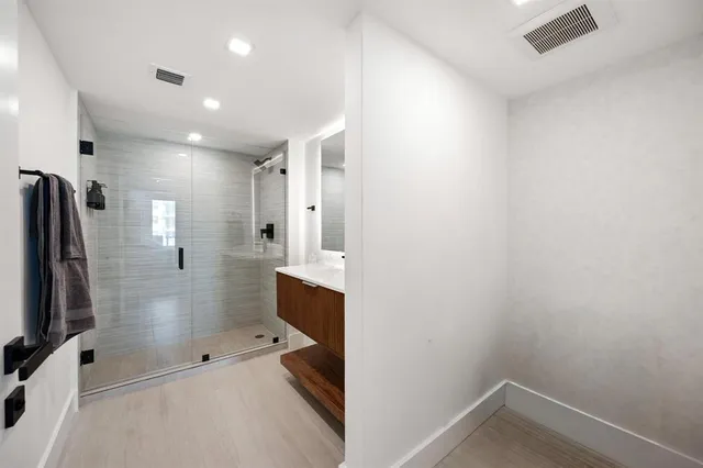 a bathroom with a shower and toilet