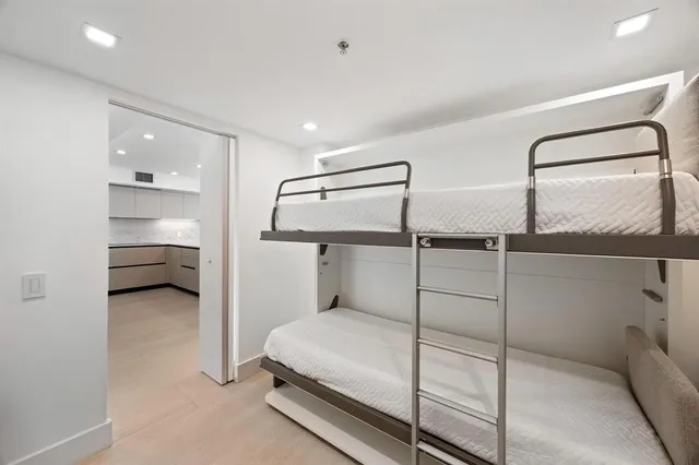 a bedroom with a bed and a walk in closet