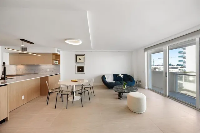 a kitchen with a table and chairs