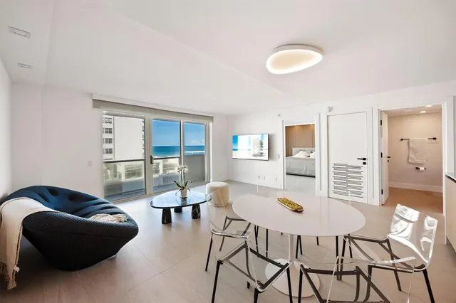 a living room with furniture and a table