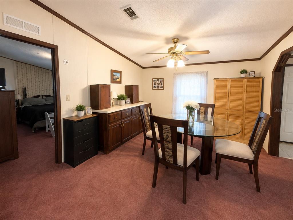 2665 Absher Road St. Cloud, FL 34771 - Photo 17 of 27 a view of a livingroom with furniture and a ceiling fan