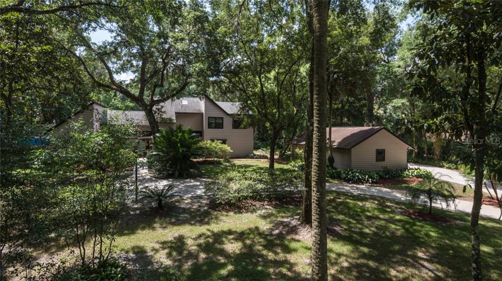 245 Stoner Road Winter Springs, FL 32708 - Photo 1 of 1 Front yard, circular driveway, detached garage