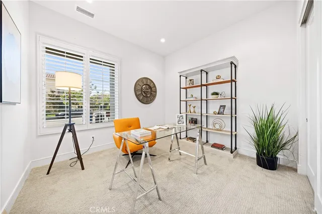 a view of a livingroom with furniture and a window