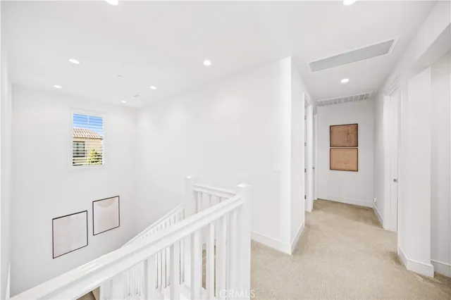 a kitchen with stainless steel appliances granite countertop a sink a microwave refrigerator and cabinets