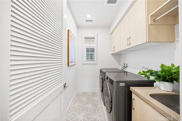 a bedroom with furniture and a large window