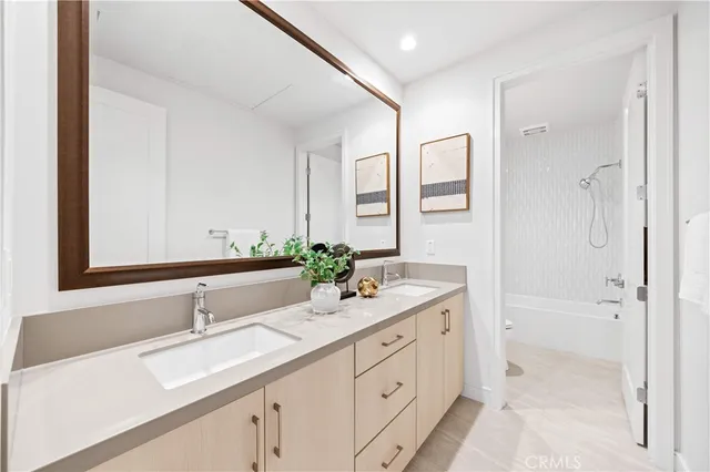 a bathroom with a bathtub and shower