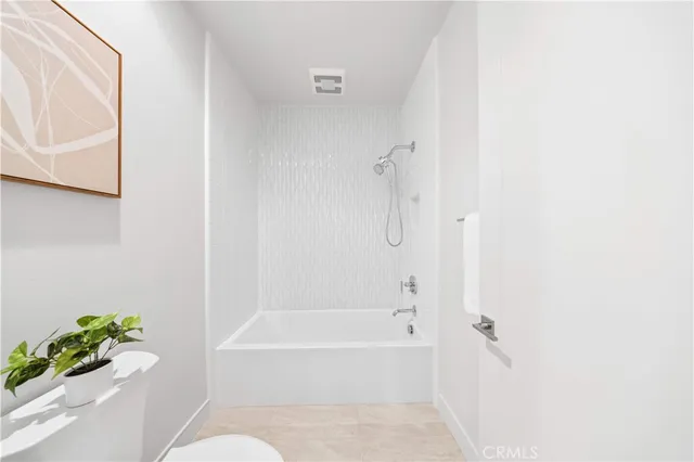 a view of a patio with a table and chairs