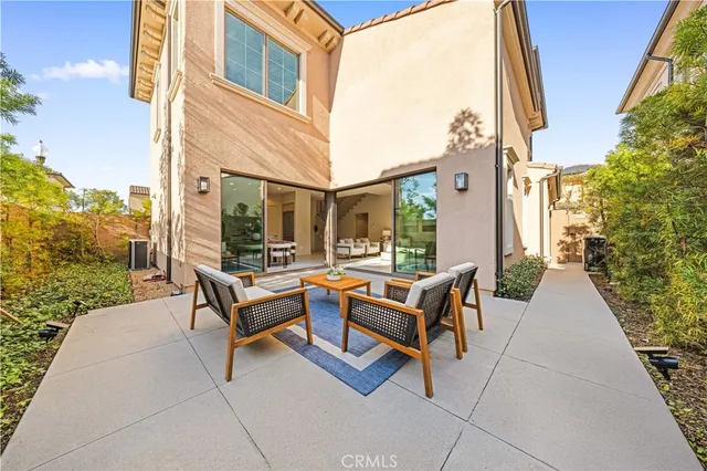 a view of swimming pool with seating area and furniture