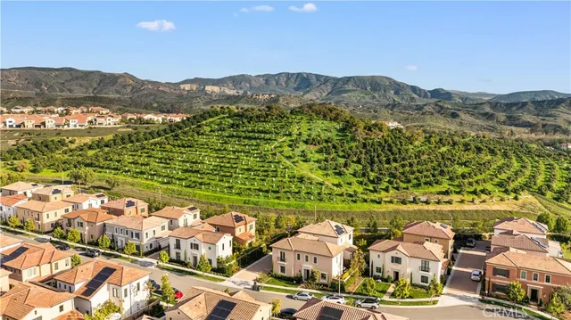 an aerial view of a house with a swimming pool
