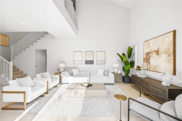 a living room with furniture and a potted plant