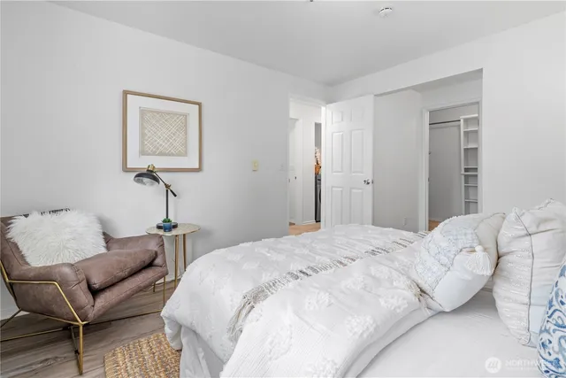 a bedroom with a bed and a couch