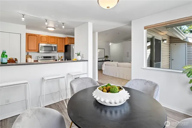 a kitchen with a table and chairs