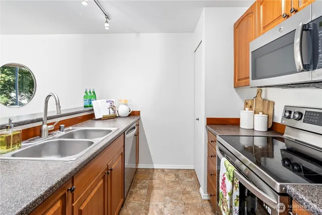 a kitchen that has a sink and a stove