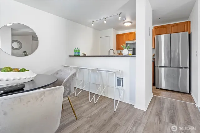 a view of kitchen with furniture and wooden floor