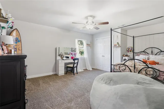 a bedroom with furniture and a window