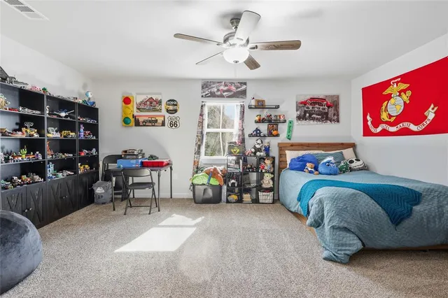 a bedroom with furniture and a chandelier