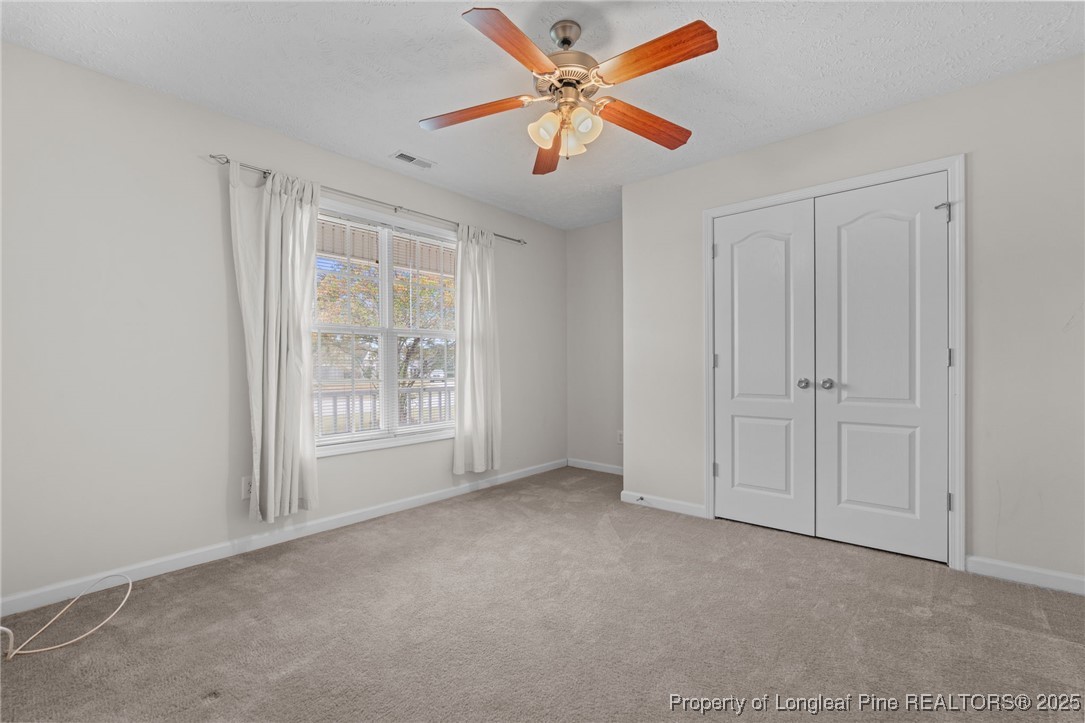 117 Usher Court Raeford, NC 28376 - Photo 19 of 48 an empty room with fan and windows