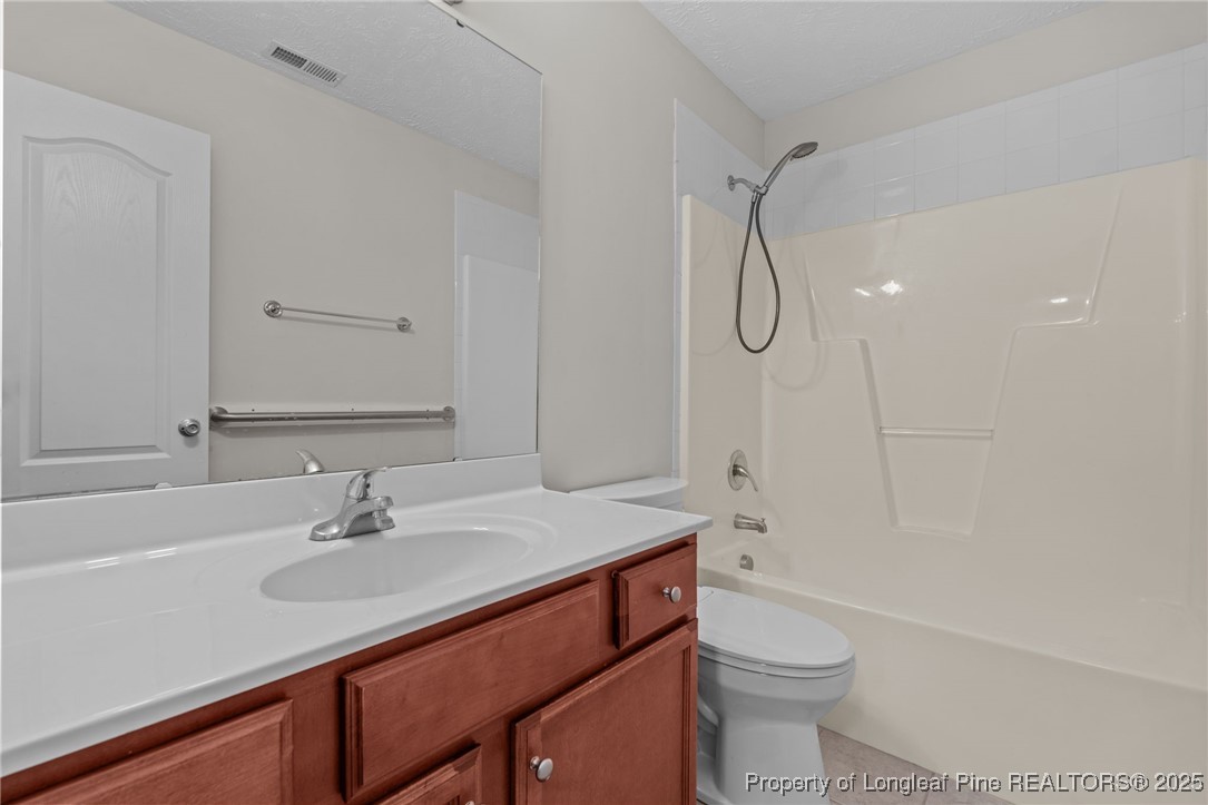 117 Usher Court Raeford, NC 28376 - Photo 27 of 48 a bathroom with a sink toilet vanity and shower