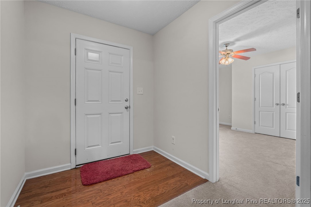 117 Usher Court Raeford, NC 28376 - Photo 32 of 48 a bedroom with a bed and a painting on the wall
