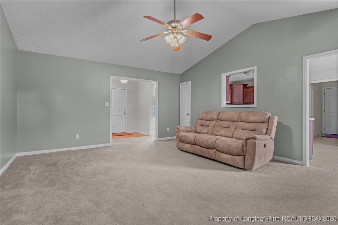 117 Usher Court Raeford, NC 28376 - Photo 36 of 48 a living room with furniture and a chandelier