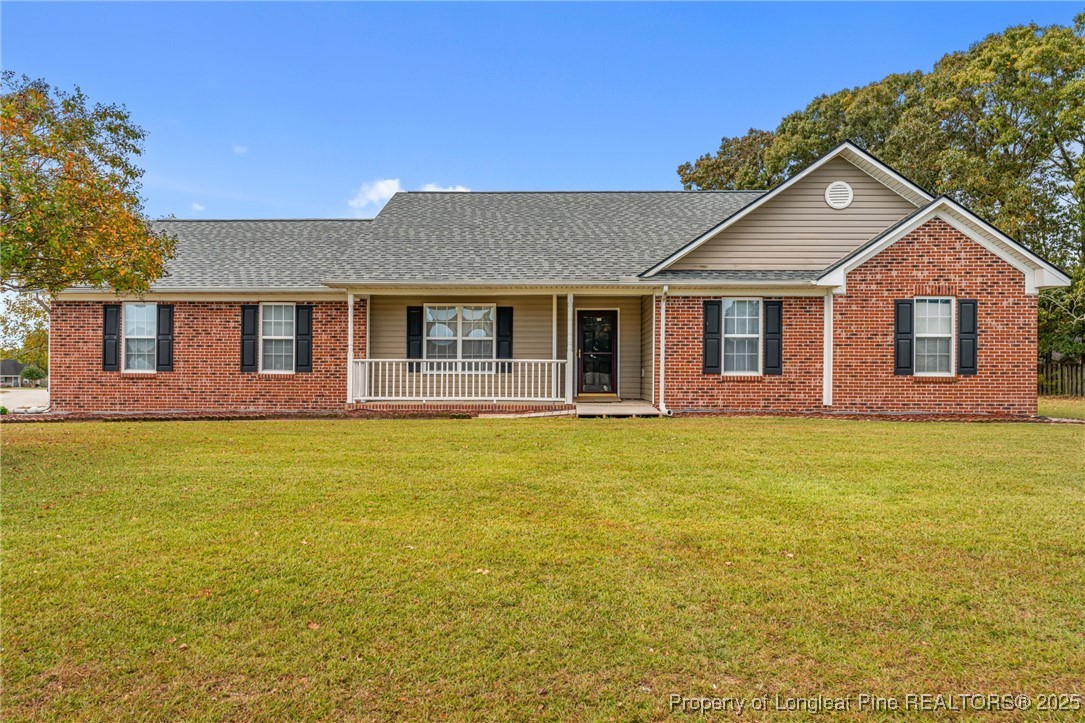 117 Usher Court Raeford, NC 28376 - Photo 7 of 48 a front view of a house with a garden