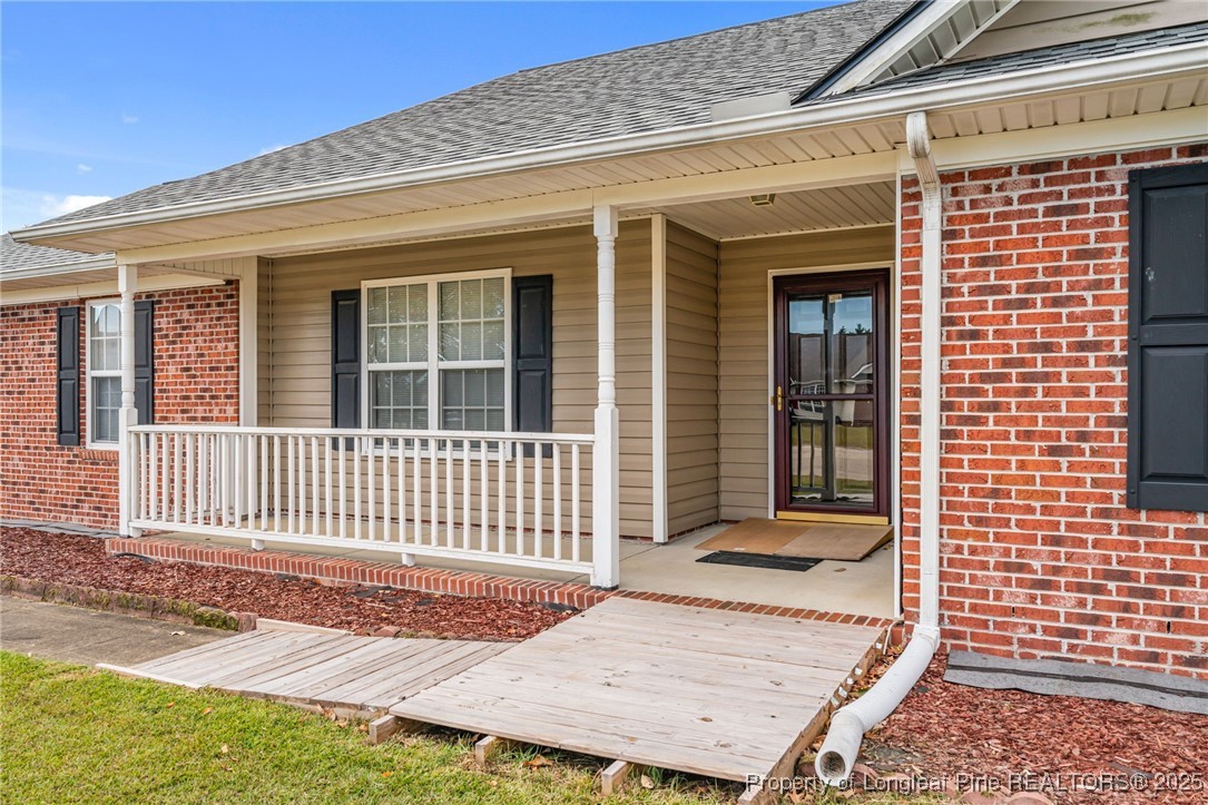 117 Usher Court Raeford, NC 28376 - Photo 10 of 48 a view of a house with a wooden fence