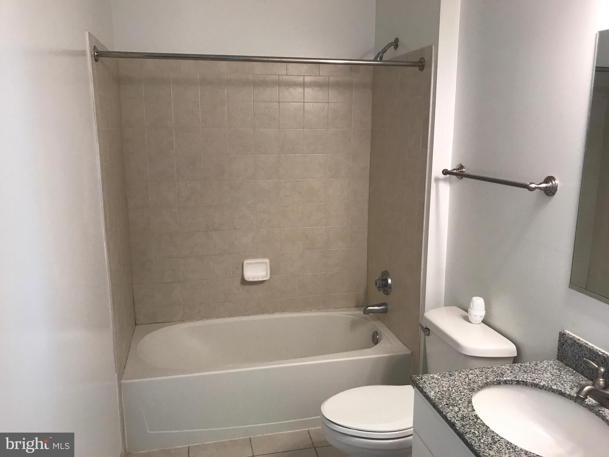 3600 South Glebe Road, Unit 330W Arlington, VA 22202 - Photo 11 of 20 a bathroom with a toilet a sink and a bathtub