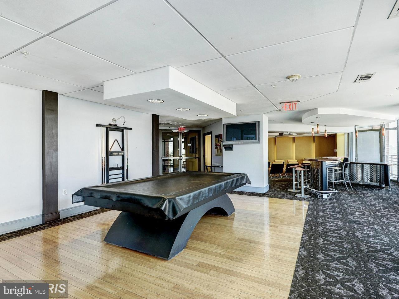 3600 South Glebe Road, Unit 330W Arlington, VA 22202 - Photo 16 of 20 a living room with furniture and wooden floor