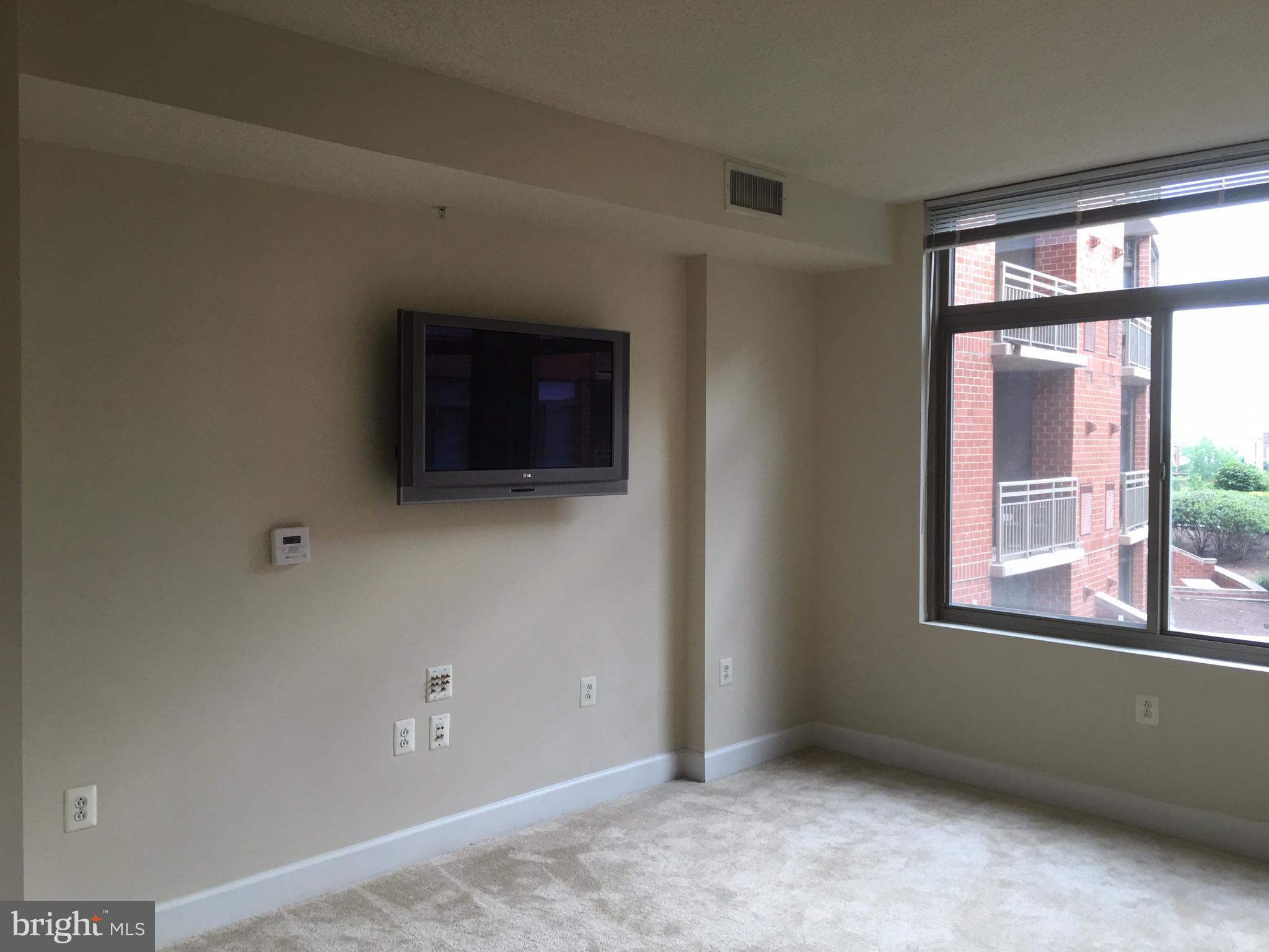 3600 South Glebe Road, Unit 330W Arlington, VA 22202 - Photo 4 of 20 a view of an empty room with a window