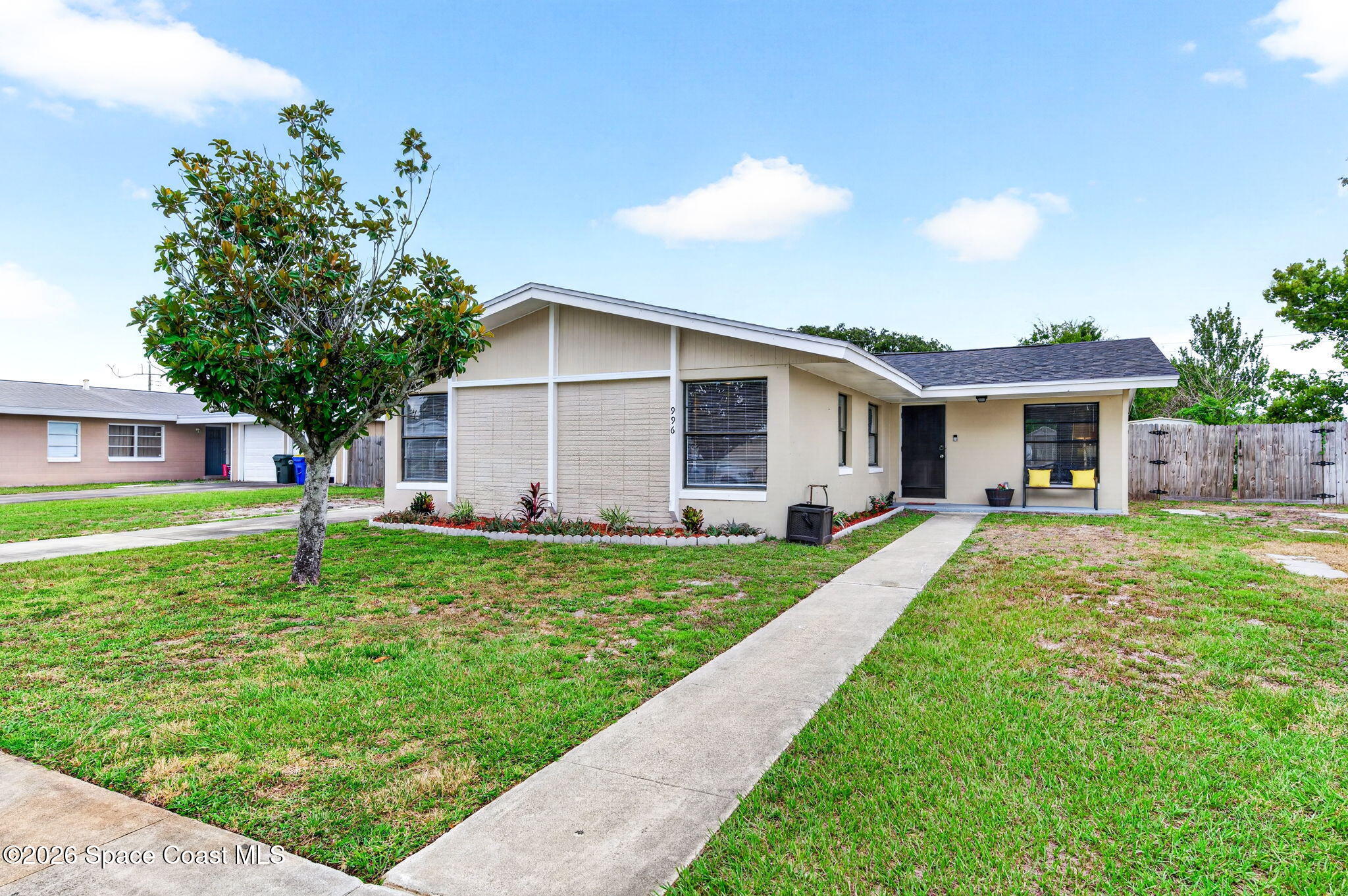 996 Botany Lane Rockledge, FL 32955 - Photo 4 of 35 a view of a house with a yard and plants