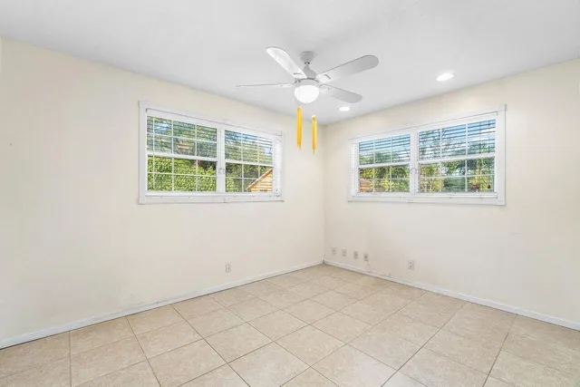 an aerial view of a house with a yard and swimming pool