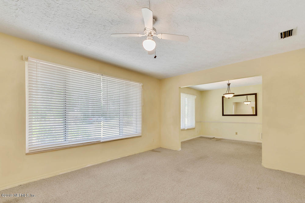 112 Faun Road St. Augustine, FL 32086 - Photo 5 of 36 a view of an empty room with a window