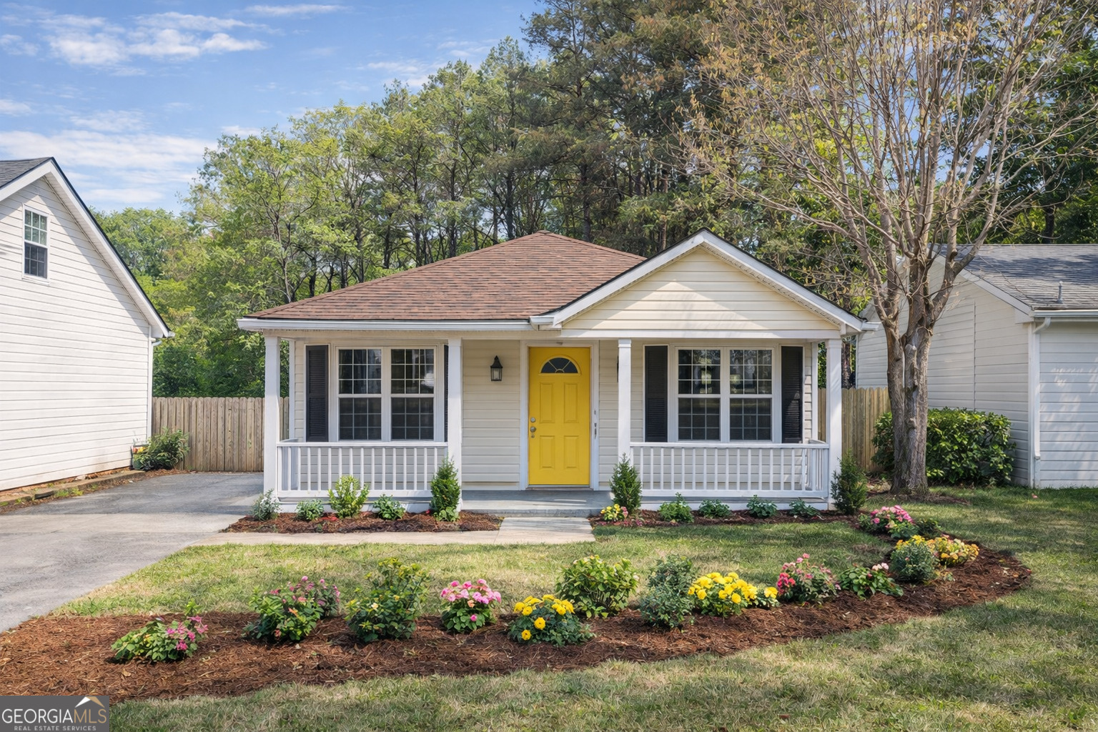 a front view of a house with garden