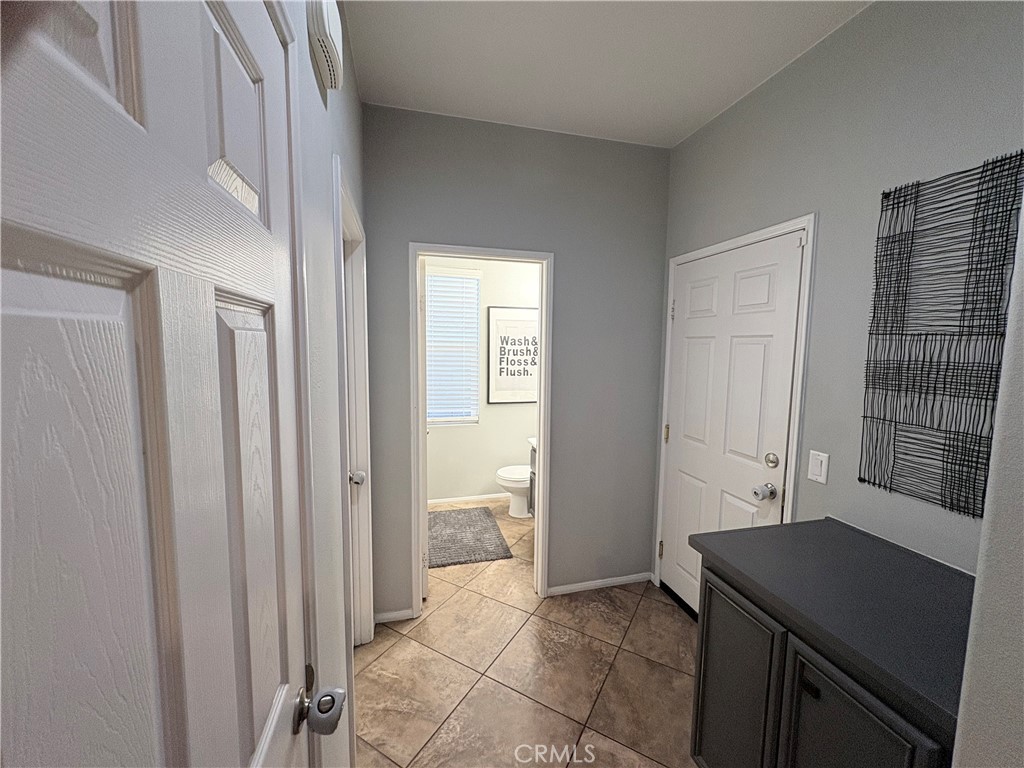 2729 Hornbeam Road Palmdale, CA 93551 - Photo 14 of 35 a view of a bathroom with tub and windows