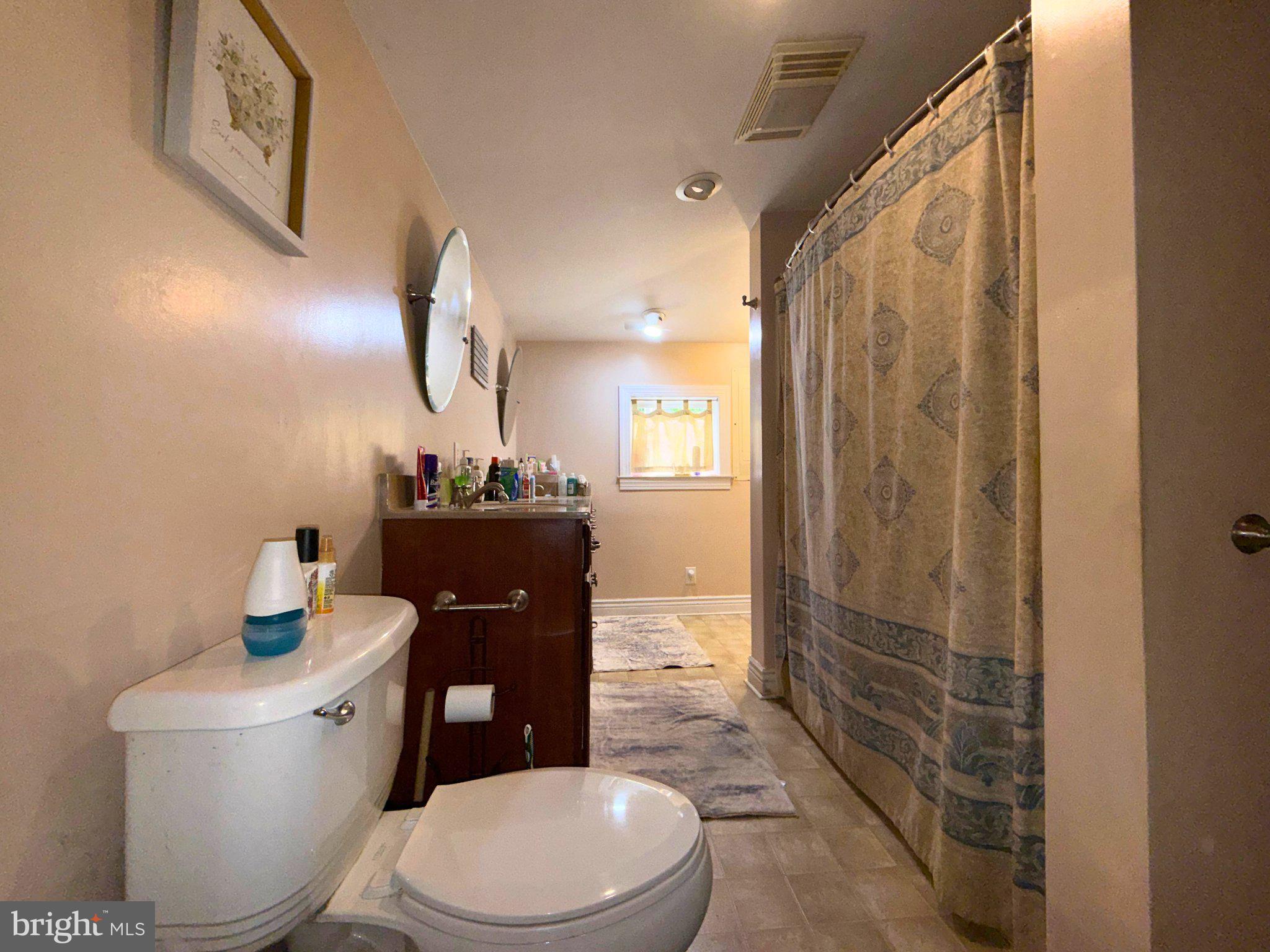 4818 Piney Neck Road Rock Hall, MD 21661 - Photo 10 of 24 a bathroom with a toilet sink and shower