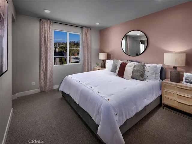 a bed room with a bed and a large window