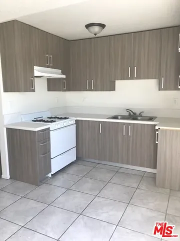 a kitchen with a cabinets and view kitchen island