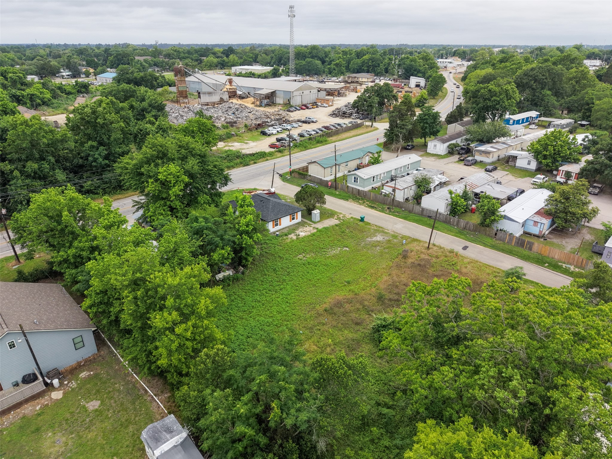 0 Mill Street Willis, TX 77378 - Photo 11 of 24 an aerial view of residential houses with outdoor space and trees