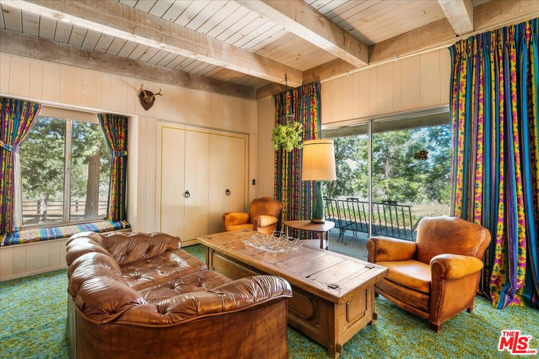 31008 Pine Canyon Road Lake Hughes, CA 93532 - Photo 18 of 29 a living room with furniture and a large window
