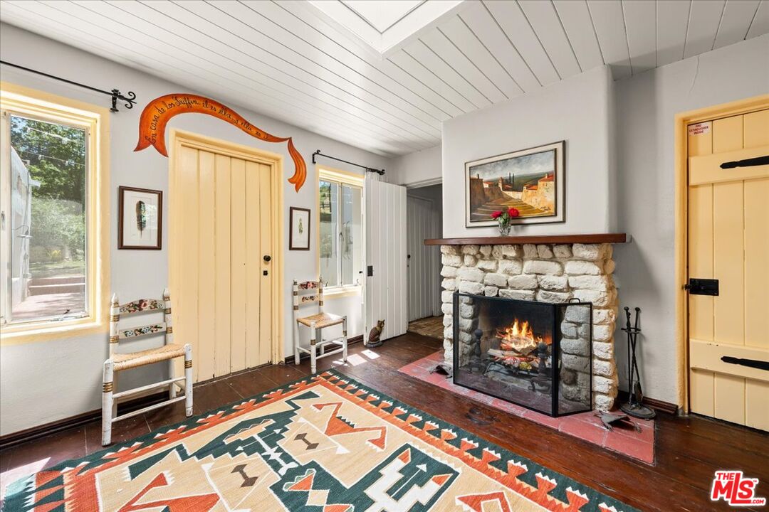 31008 Pine Canyon Road Lake Hughes, CA 93532 - Photo 7 of 29 a living room with furniture and a fireplace