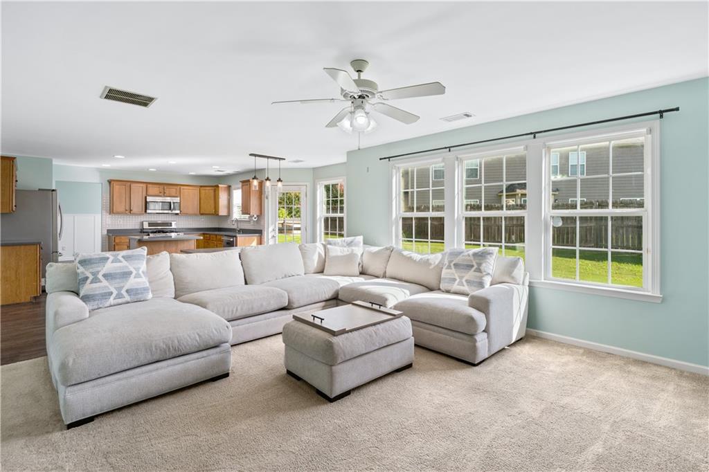 871 New Liberty Way Braselton, GA 30517 - Photo 14 of 47 a living room with furniture and a large window