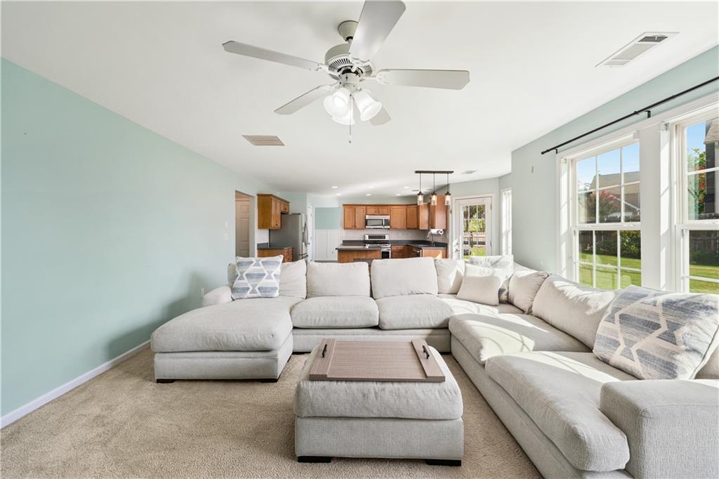871 New Liberty Way Braselton, GA 30517 - Photo 15 of 47 a living room with furniture and a large window