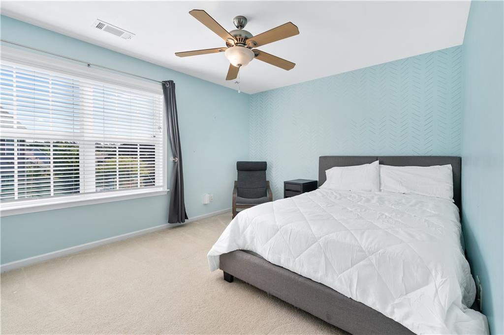 871 New Liberty Way Braselton, GA 30517 - Photo 26 of 47 a bedroom with a bed and window