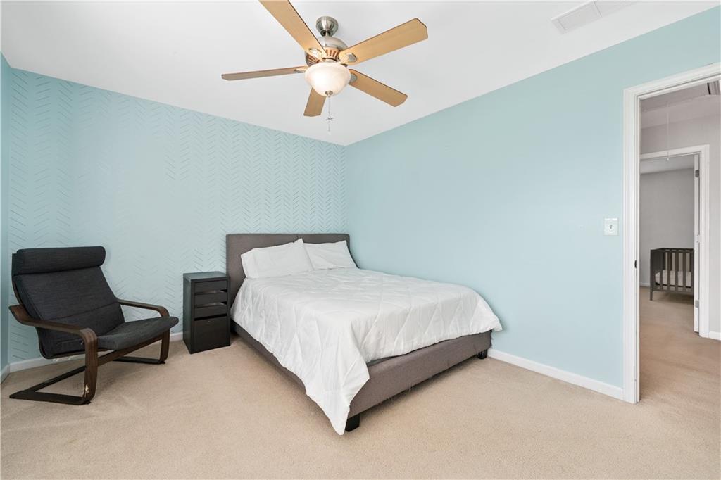 871 New Liberty Way Braselton, GA 30517 - Photo 27 of 47 a bedroom with a bed and a chair