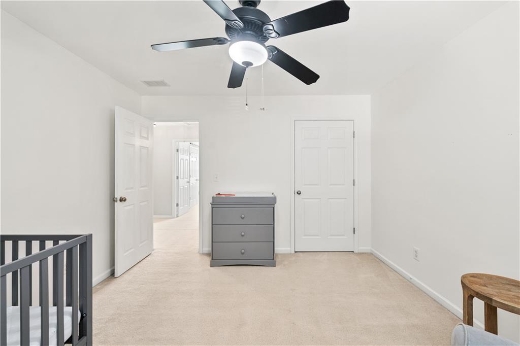 871 New Liberty Way Braselton, GA 30517 - Photo 29 of 47 an empty room with chandelier fan