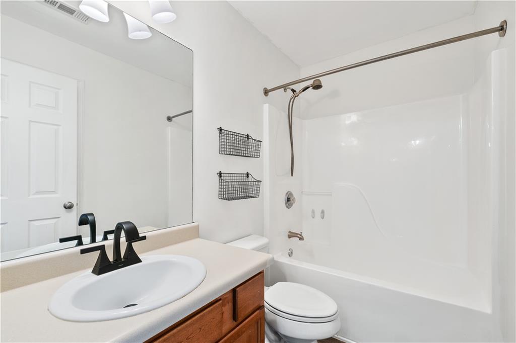 871 New Liberty Way Braselton, GA 30517 - Photo 32 of 47 a bathroom with a sink toilet and shower