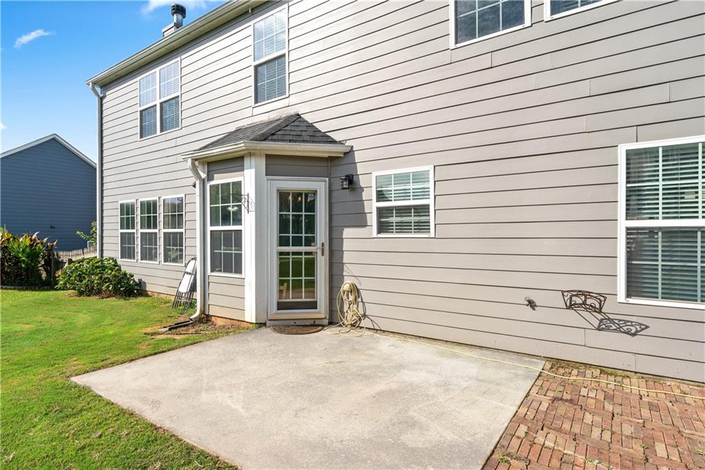 871 New Liberty Way Braselton, GA 30517 - Photo 33 of 47 a front view of a house with a yard
