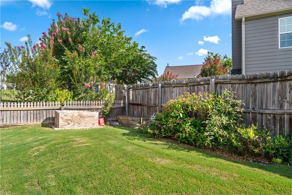 871 New Liberty Way Braselton, GA 30517 - Photo 34 of 47 a view of a backyard with a garden