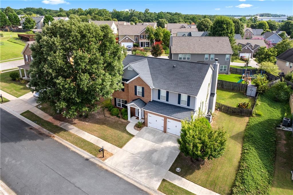 871 New Liberty Way Braselton, GA 30517 - Photo 41 of 47 an aerial view of a house with swimming pool and large trees