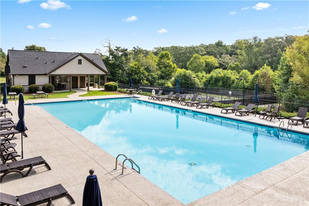 871 New Liberty Way Braselton, GA 30517 - Photo 44 of 47 a view of a swimming pool with a table and chairs